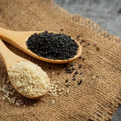 White sesame and black sesame on dark background